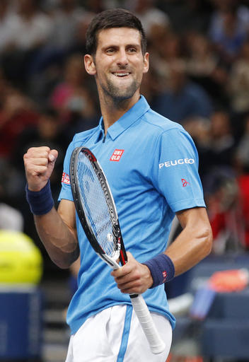 Novak Djokovic of Serbia celebrates his win over Grigor Dimitrov of Bulgaria during the 3rd round of the Paris Masters tennis tournament at the Bercy Arena in Paris, Thursday, Nov. 3, 2016. Djokovic won 4-6, 6-2, 6-3. (AP Photo/Michel Euler)