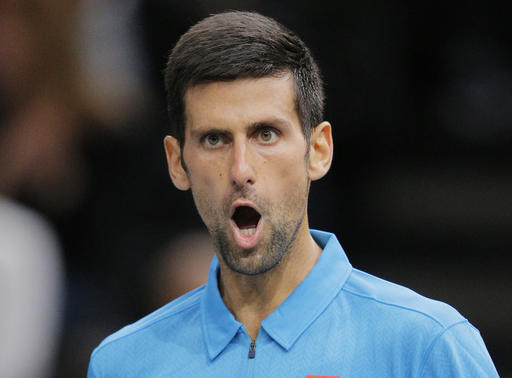 Novak Djokovic of Serbia reacts after making a point against Grigor Dimitrov of Bulgaria during the 3rd round of the Paris Masters tennis tournament at the Bercy Arena in Paris, Thursday, Nov. 3, 2016. Djokovic won 4-6, 6-2, 6-3. (AP Photo/Michel Euler)