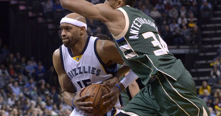 Memphis Grizzlies guard Vince Carter, left, drives against Milwaukee Bucks forward Giannis Antetokounmpo (34) in the second half of an NBA basketball game, Monday, March 13, 2017, in Memphis, Tenn. (AP Photo/Brandon Dill)