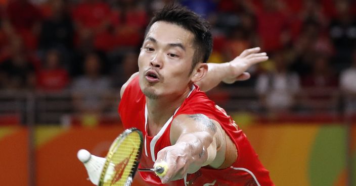 FILE- In this Saturday, Aug. 20, 2016 file photo, China's Lin Dan returns a shot to Denmark's Viktor Axelsen during the men's badminton singles bronze medal match at the 2016 Summer Olympics in Rio de Janeiro, Brazil. Lin Dan didn’t retire after the Rio de Janeiro Olympics when most observers thought he would. (AP Photo/Vincent Thian, File)