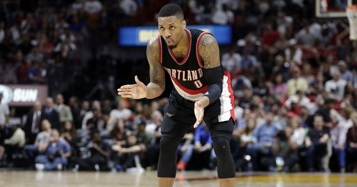 Portland Trail Blazers' Damian Lillard (0) watches the second half of an NBA basketball game against the Miami Heat, Sunday, March 19, 2017, in Miami. (AP Photo/Lynne Sladky)