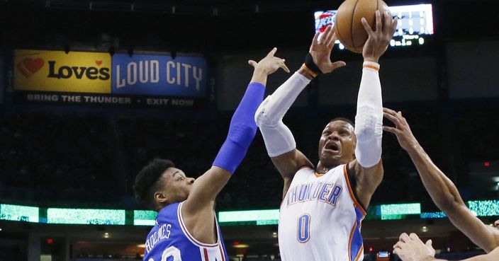 Oklahoma City Thunder guard Russell Westbrook (0) shoots in front of Philadelphia 76ers forward Richaun Holmes (22) during the first quarter of an NBA basketball game in Oklahoma City, Wednesday, March 22, 2017. (AP Photo/Sue Ogrocki)