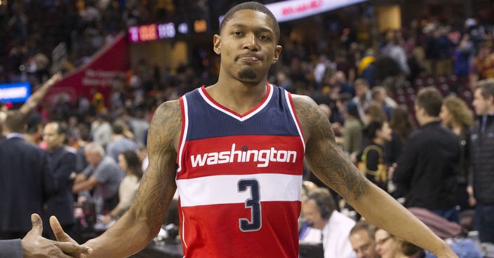 Washington Wizards' Bradley Beal (3) gets a handshake after the Wizards 127-115 win of an NBA basketball game over the Cleveland Cavaliers in Cleveland, Saturday, March 25, 2017. (AP Photo/Phil Long)