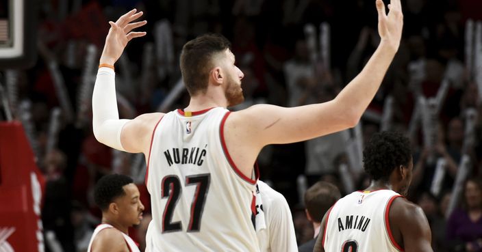 Portland Trail Blazers center Jusuf Nurkic celebrates as he walks off the court during a time out during the second half of an NBA basketball game against the Denver Nuggets in Portland, Ore., Tuesday, March 28, 2017. Nurkic had a career-high 33 points with 16 rebounds against his former team. Blazers won 122-113. (AP Photo/Steve Dykes)