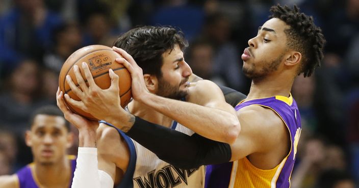 Los Angeles Lakers' D'Angelo Russell, right, tries to wrest the ball away from Minnesota Timberwolves' Ricky Rubio, of Spain, during the second half of an NBA basketball game Thursday, March 30, 2017, in Minneapolis. (AP Photo/Jim Mone)
