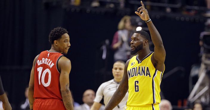 Indiana Pacers forward Paul George (13) celebrates as Toronto Raptors guard DeMar DeRozan (10) watches during the second half of an NBA basketball game in Indianapolis, Tuesday, April 4, 2017. The Pacers defeated the Raptors 108-90. (AP Photo/Michael Conroy)