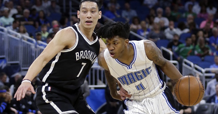 Orlando Magic's Elfrid Payton (4) drives around Brooklyn Nets' Jeremy Lin (7) during the first half of an NBA basketball game, Thursday, April 6, 2017, in Orlando, Fla. (AP Photo/John Raoux)