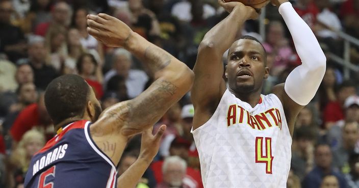 Atlanta Hawks' Paul Millsap shoots over Washington Wizards' Markieff Morris during Game 3 of an NBA basketball first-round playoff series Saturday, April 22, 2017, in Atlanta. (Curtis Compton/Atlanta Journal-Constitution via AP)