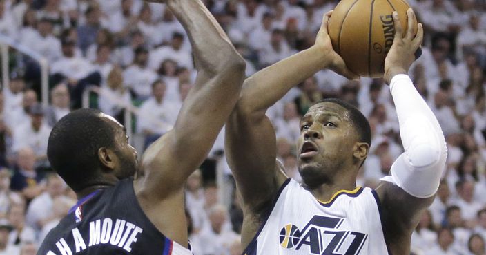 Utah Jazz forward Joe Johnson (6) shoots as Los Angeles Clippers forward Luc Mbah a Moute (12) defends during the second half in Game 4 of an NBA basketball first-round playoff series Sunday, April 23, 2017, in Salt Lake City. The Jazz won 105-98. (AP Photo/Rick Bowmer)