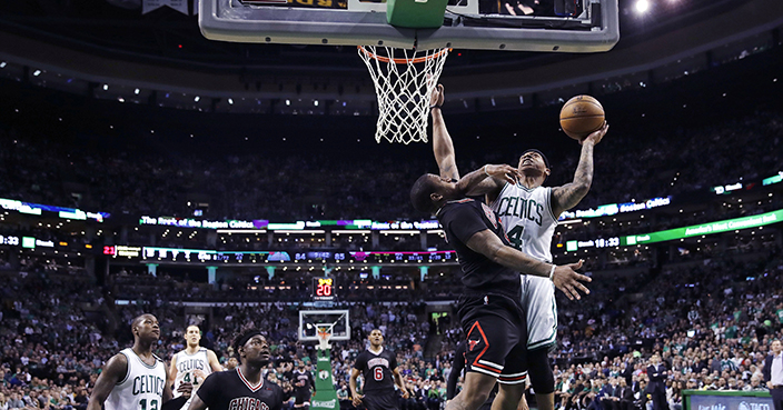 Boston Celtics guard Isaiah Thomas (4) drives to the basket against Chicago Bulls guard Isaiah Canaan (0) during the fourth quarter of a first-round NBA playoff basketball game in Boston, Wednesday, April 26, 2017. Thomas scored 24 points as the Celtics defeated the Bulls 108-97. (AP Photo/Charles Krupa)