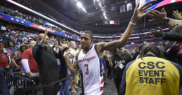 Washington Wizards guard Bradley Beal (3) greets fans after Game 5 of the team's first-round NBA basketball playoff series against the Atlanta Hawks, Wednesday, April 26, 2017, in Washington. The Wizards won 103-99. (AP Photo/Nick Wass)