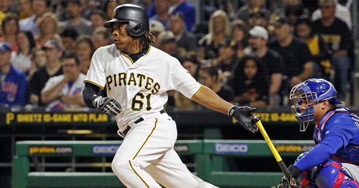 Pittsburgh Pirates' Gift Ngoepe, a native of South Africa, and the first baseball player from the continent of Africa to play in the Major Leagues, hits a single off Chicago Cubs starting pitcher Jon Lester in his first at-bat in the fourth inning of a baseball game in Pittsburgh, Wednesday, April 26, 2017. (AP Photo/Gene J. Puskar)