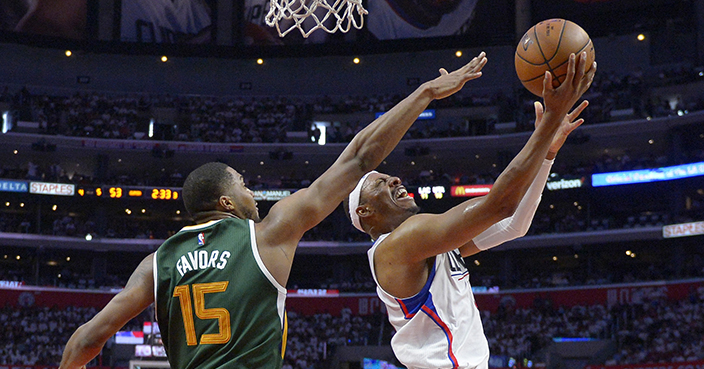 Los Angeles Clippers forward Paul Pierce, right, shoots as Utah Jazz forward Derrick Favors defends during the second half in Game 7 of an NBA basketball first-round playoff series, Sunday, April 30, 2017, in Los Angeles. The Jazz won 104-91. (AP Photo/Mark J. Terrill)