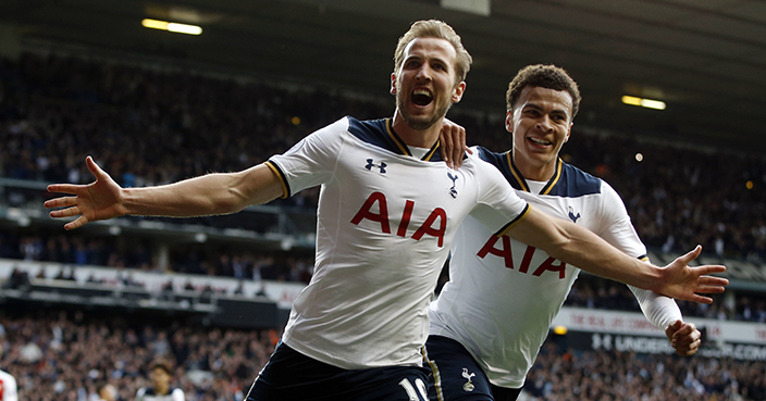 Tottenham Hotspur's Harry Kane, front, celebrates after scoring a penalty during the English Premier League soccer match between Tottenham Hotspur and Arsenal at White Hart Lane in London, Sunday, April 30, 2017. (AP Photo/Alastair Grant)