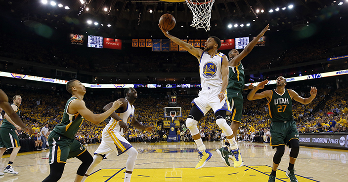 Golden State Warriors' Stephen Curry (30) scores against the Utah Jazz during the first half in Game 1 of an NBA basketball second-round playoff series, Tuesday, May 2, 2017, in Oakland, Calif. (AP Photo/Marcio Jose Sanchez)