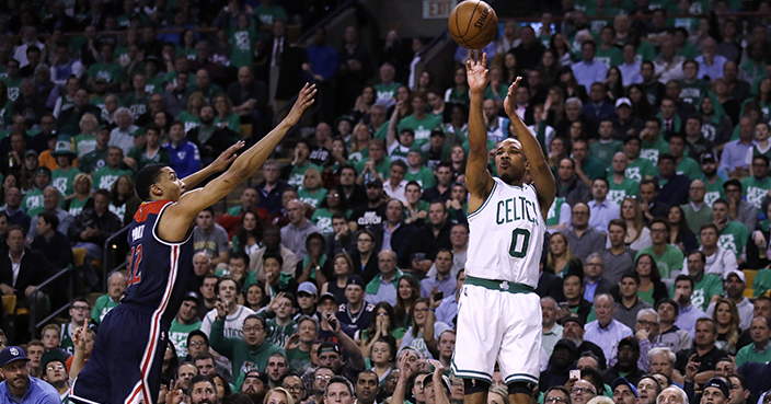 Boston Celtics guard Avery Bradley (0) shoots a 3-pointer as Washington Wizards forward Otto Porter Jr. defends during the second quarter of Game 5 of an NBA basketball second-round playoff series, in Boston, Wednesday, May 10, 2017. (AP Photo/Charles Krupa)