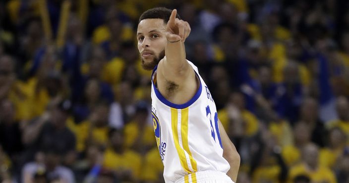 Golden State Warriors' Stephen Curry signals after scoring against the San Antonio Spurs during the first half of Game 2 of the NBA basketball Western Conference finals, Tuesday, May 16, 2017, in Oakland, Calif. (AP Photo/Marcio Jose Sanchez)