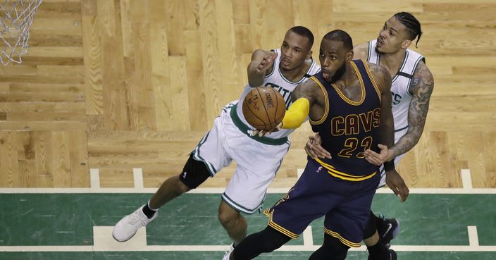 Cleveland Cavaliers forward LeBron James (23) drives to the basket as Boston Celtics guard Avery Bradley, left, and forward Gerald Green, right, try to defend during the fourth quarter of Game 1 of the NBA basketball Eastern Conference finals, Wednesday, May 17, 2017, in Boston. (AP Photo/Charles Krupa)