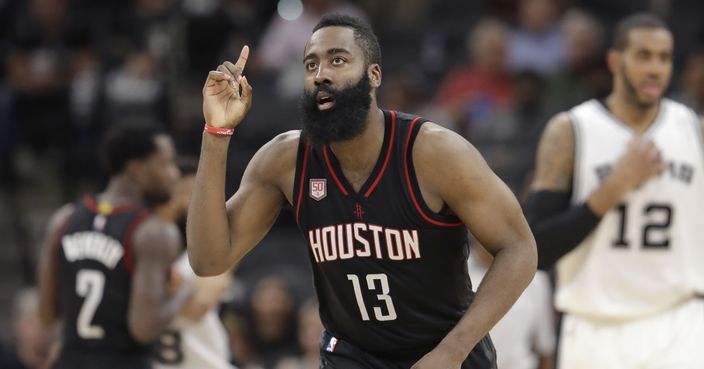 FILE - In this May 9, 2017, file photo, Houston Rockets guard James Harden (13) gestures during the second half of Game 5 in a second-round NBA basketball playoff series against the San Antonio Spurs, in San Antonio. For Cleveland's LeBron James, there was history. For Houston's James Harden, there was affirmation. James and Harden headlined the All-NBA first team that was unveiled Thursday, May 18, 2017. (AP Photo/Eric Gay, File)