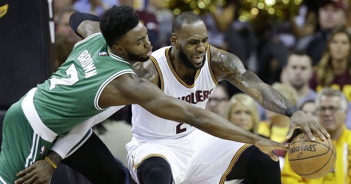 Boston Celtics' Jaylen Brown (7) defends against Cleveland Cavaliers' LeBron James (23) during the first half of Game 3 of the NBA basketball Eastern Conference finals, Sunday, May 21, 2017, in Cleveland. (AP Photo/Tony Dejak)