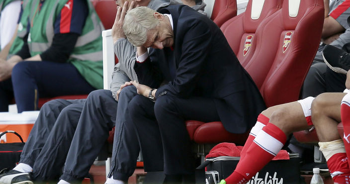 Arsenal manager Arsene Wenger looks dejected during the English Premier League soccer match between Arsenal and Everton at The Emirates stadium in London, Sunday May 21, 2017. (AP Photo/Tim Ireland)