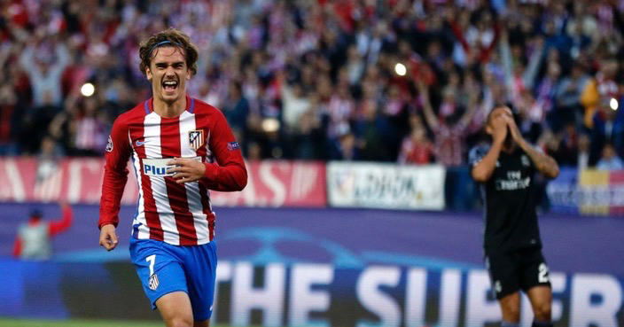 Atletico's Antoine Griezmann, left, celebrates after scoring a penalty during a Champions League semifinal, 2nd leg soccer match between Atletico de Madrid and Real Madrid, in Madrid, Spain, Wednesday, May 10, 2017 . (AP Photo/Daniel Ochoa de Olza)