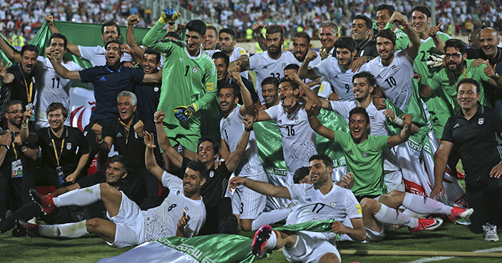 Iran national soccer team celebrates after beating Uzbekistan in their Asia Group A, 2018 World Cup qualifying soccer match at the Azadi Stadium in Tehran, Iran, Monday, June 12, 2017. Iran became the second team to qualify for the 2018 World Cup by beating Uzbekistan 2-0. (AP Photo/Vahid Salemi)