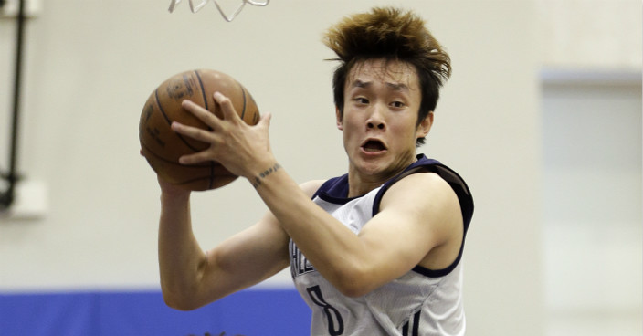 Dallas Mavericks' Ding Yanyuhang grabs a rebound in front of Orlando Magic's Jonathan Isaac (1) during the first half of an NBA summer league basketball game, Monday, July 3, 2017, in Orlando, Fla. (AP Photo/John Raoux)