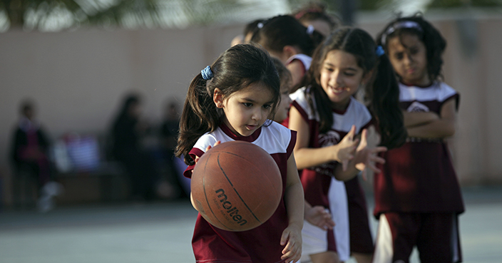 FILE- In this May 12, 2014 file photo, Saudi and expatriate girls practice basketball at a private sports club in Jiddah, Saudi Arabia. Saudi Arabia's Education Ministry said Tuesday July 11, 2017,  it will introduce physical education classes for girls in public schools next year, a decision that comes after years of calls by women across the kingdom demanding greater rights and greater access to sports. (AP Photo/Hasan Jamali, FILE)
