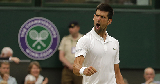 Serbia's Novak Djokovic celebrates winning a point as he plays against Adrian Mannarino of France during their Men's Singles Match on day eight at the Wimbledon Tennis Championships in London Tuesday, July 11, 2017. (AP Photo/Alastair Grant)