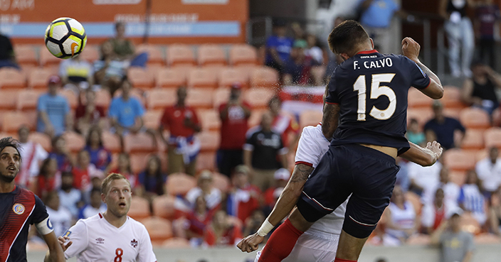 Costa Rica's Francisco Calvo (15) heads the ball for a goal against Canada in the first half of a CONCACAF Gold Cup soccer match in Houston, Tuesday, July 11, 2017. (AP Photo/David J. Phillip)