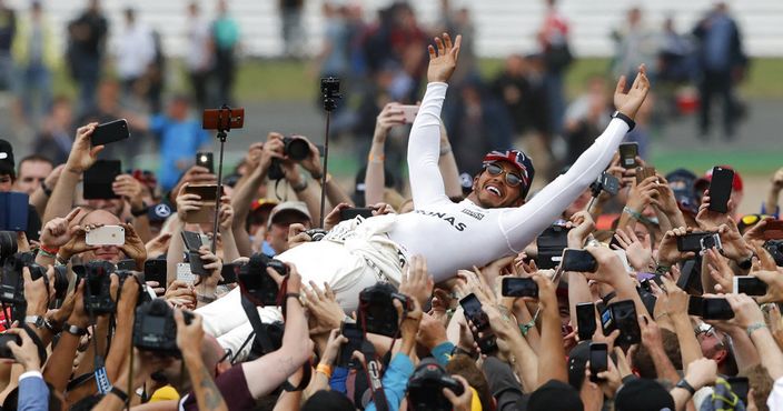 Mercedes driver Lewis Hamilton of Britain celebrates after winning the British Formula One Grand Prix at the Silverstone racetrack in Silverstone, England, Sunday, July 16, 2017. (AP Photo/Frank Augstein)