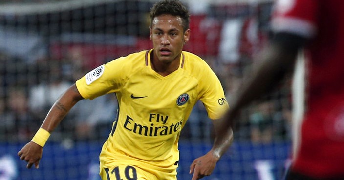 PSG's Neymar, center, controls the ball during the French League One soccer match between Guingamp and PSG at the Roudourou stadium in Guingamp, western France, Sunday, Aug. 13, 2017. Neymar makes his long-awaited debut with Paris Saint-Germain on Sunday in the small Brittany town of Guingamp. (AP Photo/Kamil Zihnioglu)