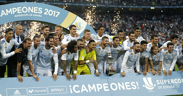 Real Madrid's players pose for the media with their trophy after winning the Spanish Super Cup against Barcelona at the Santiago Bernabeu stadium in Madrid, Thursday, Aug. 17, 2017. Real Madrid won 5-1 on aggregate. (AP Photo/Francisco Seco)