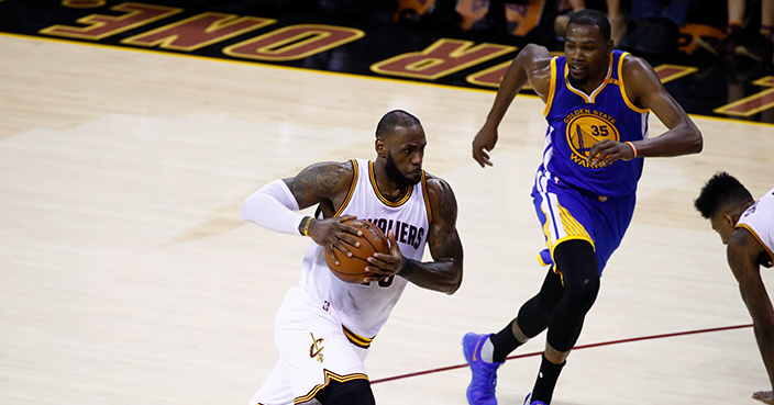 CLEVELAND, OH - JUNE 07: LeBron James #23 of the Cleveland Cavaliers is defended by Kevin Durant #35 of the Golden State Warriors during the first half of Game 3 of the 2017 NBA Finals at Quicken Loans Arena on June 7, 2017 in Cleveland, Ohio. NOTE TO USER: User expressly acknowledges and agrees that, by downloading and or using this photograph, User is consenting to the terms and conditions of the Getty Images License Agreement.  (Photo by Gregory Shamus/Getty Images)