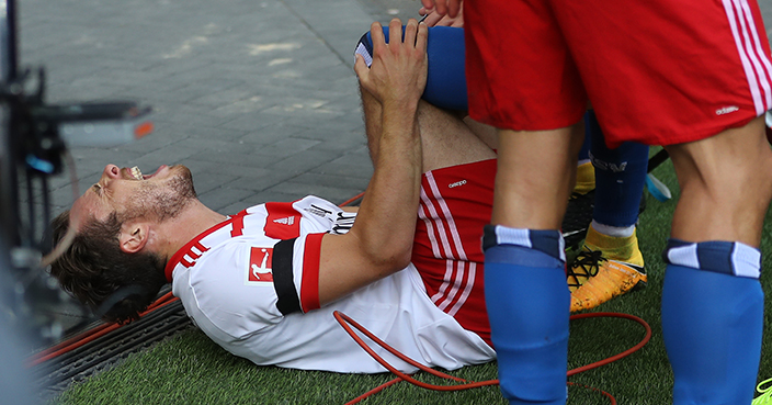 HAMBURG, GERMANY - AUGUST 19:  Nicolai Mueller of Hamburg injure after his scoring the opening goal during the Bundesliga match between Hamburger SV and FC Augsburg at Volksparkstadion on August 19, 2017 in Hamburg, Germany.  (Photo by Oliver Hardt/Bongarts/Getty Images)