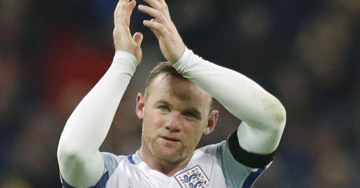 FILE - This is a Friday, Nov. 11, 2016  file photo of England's Wayne Rooney as he claps after winning the World Cup group F qualifying soccer match between England and Scotland with a 3-0 score at the Wembley stadium, London. England striker Wayne Rooney announced his immediate retirement from international football on Wednesday Aug. 23, 2017. (AP Photo/Matt Dunham/File)