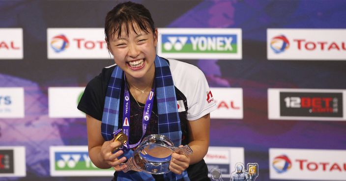 Japan's Nozomi Okuhara reacts on the podium after winning gold in the women singles final on day seven of the 2017 BWF World Championships at the Emirates Arena in Glasgow, Scotland, Sunday Aug. 27, 2017. (Jane Barlow/PA via AP)