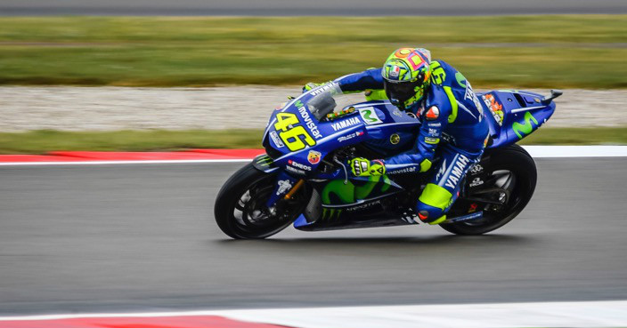 Moto GP rider Valentino Rossi of Italy steers his motorcycle during the MotoGP qualifying session ahead of the Dutch Grand Prix, in Assen, northern Netherlands, Saturday, June 24, 2017. (AP Photo/Geert Vanden Wijngaert)