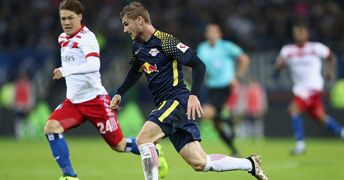 HAMBURG, GERMANY - SEPTEMBER 08: Timo Werner of Leipzig eludes Gotoku Sakai of Hamburg on his way to score his team's second goal during the Bundesliga match between Hamburger SV and RB Leipzig at Volksparkstadion on September 8, 2017 in Hamburg, Germany.  (Photo by Oliver Hardt/Bongarts/Getty Images)