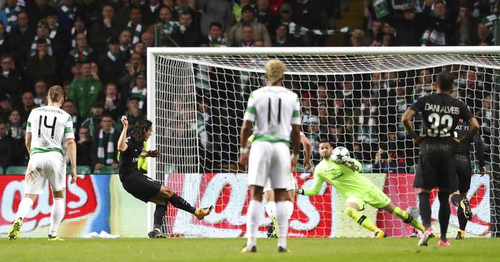 PSG's Edinson Cavani, second left, scores his side's third goal of the game from the penalty spot, during the Champions League, Group B soccer match between Celtic and Paris Saint-Germain,  at Celtic Park, in Glasgow, Scotland,  Tuesday Sept. 12, 2017. (Andrew Milligan/PA via AP)
