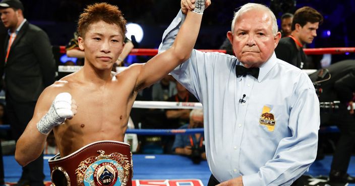 CORRECTS LAST NAME TO INOUE - Naoya Inoue, of Japan, poses for photos after defeating Antonio Nieves during their WBO super flyweight championship boxing match Saturday, Sept. 9, 2017, in Carson, Calif. (AP Photo/Chris Carlson)