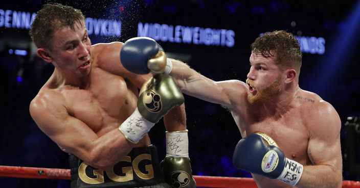 Canelo Alvarez, right, fights Gennady Golovkin during a middleweight title fight Saturday, Sept. 16, 2017, in Las Vegas. (AP Photo/John Locher)