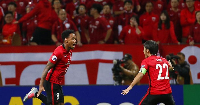 Urawa Reds' Rafael da Silva, left, celebrates after scoring a goal against Shanghai SIPG in the second leg of their Asian Champions League semifinal soccer match in Saitama, Wednesday, Oct. 18, 2017.(AP Photo/Shuji Kajiyama)