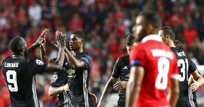 Manchester United's Marcus Rashford, second left, celebrates his goal with his teammates against Benfica during their Champions League group A soccer match between Manchester United and Benfica at Benfica's Luz stadium in Lisbon, Wednesday, Oct. 18, 2017. (AP Photo/Armando Franca)