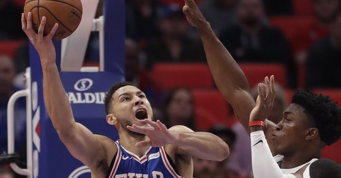 Philadelphia 76ers guard Ben Simmons (25) shoots as Detroit Pistons forward Stanley Johnson, right, defends during the first half of an NBA basketball game, Monday, Oct. 23, 2017, in Detroit. (AP Photo/Carlos Osorio)