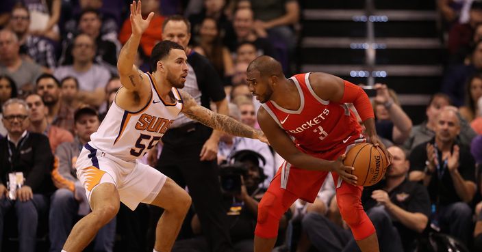 PHOENIX, AZ - NOVEMBER 16: Chris Paul #3 of the Houston Rockets handles the ball against Mike James #55 of the Phoenix Suns during the second half of the NBA game at Talking Stick Resort Arena on November 16, 2017 in Phoenix, Arizona.  The Rockets defeated the Suns 142-116.  NOTE TO USER: User expressly acknowledges and agrees that, by downloading and or using this photograph, User is consenting to the terms and conditions of the Getty Images License Agreement.  (Photo by Christian Petersen/Getty Images)
