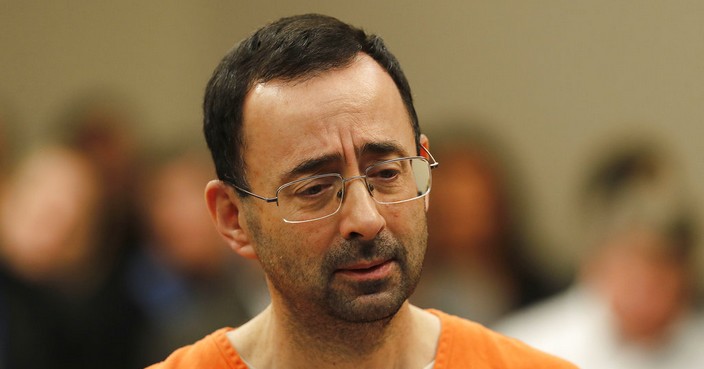 Dr. Larry Nassar appears in court for a plea hearing in Lansing, Mich., Wednesday, Nov. 22, 2017. Nasser, a sports doctor accused of molesting girls while working for USA Gymnastics and Michigan State University, pleaded guilty to multiple charges of sexual assault and will face at least 25 years in prison. (AP Photo/Paul Sancya)