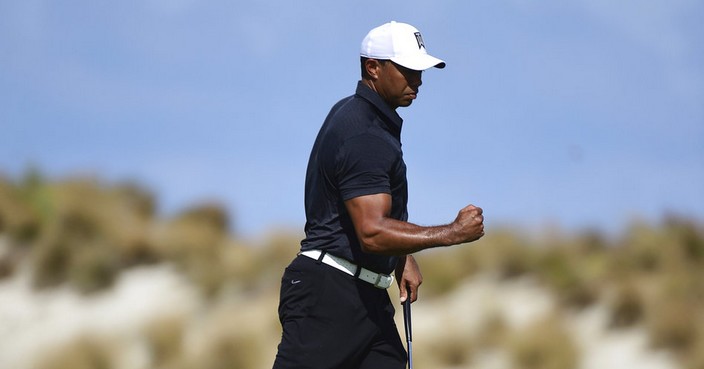 Tiger Woods reacts on the fourth hole at the Hero World Challenge golf tournament at Albany Golf Club in Nassau, Bahamas, Thursday, Nov. 30, 2017. (AP Photo/Dante Carrer)