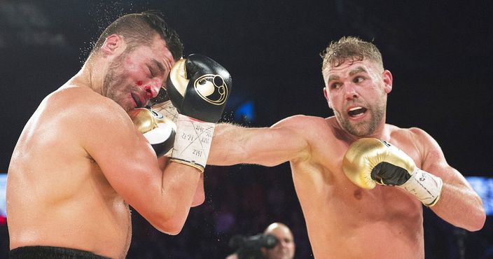 David Lemieux, left, of Laval, Quebec, takes a right to the jaw from champion Billy Joe Saunders, of Britain, during their WBO middleweight boxing title match in Laval, Quebec, Saturday, Dec. 16, 2017. (Ryan Remiorz/The Canadian Press via AP)